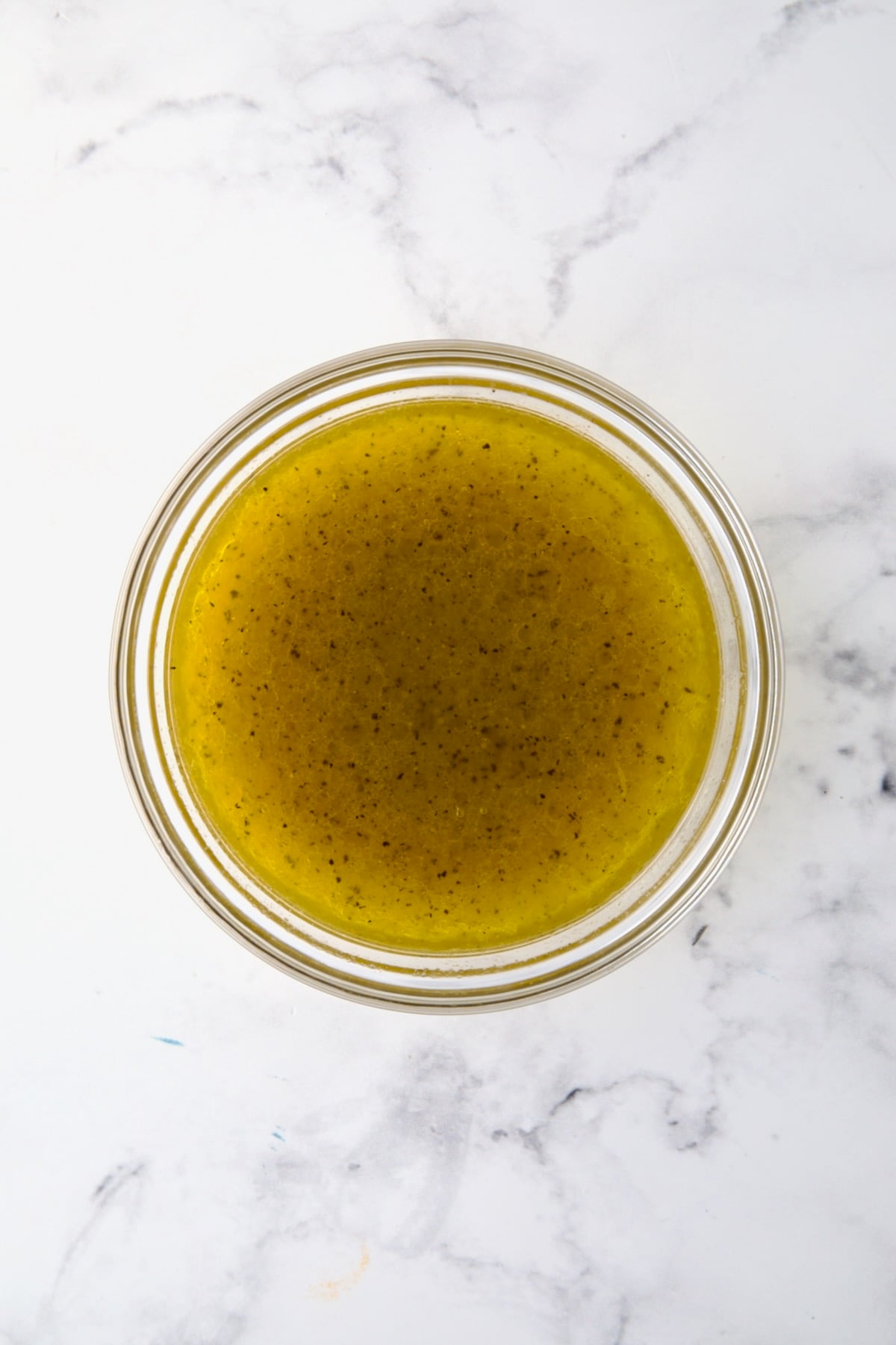 Dressing for Chicken Couscous Salad in glass bowl.