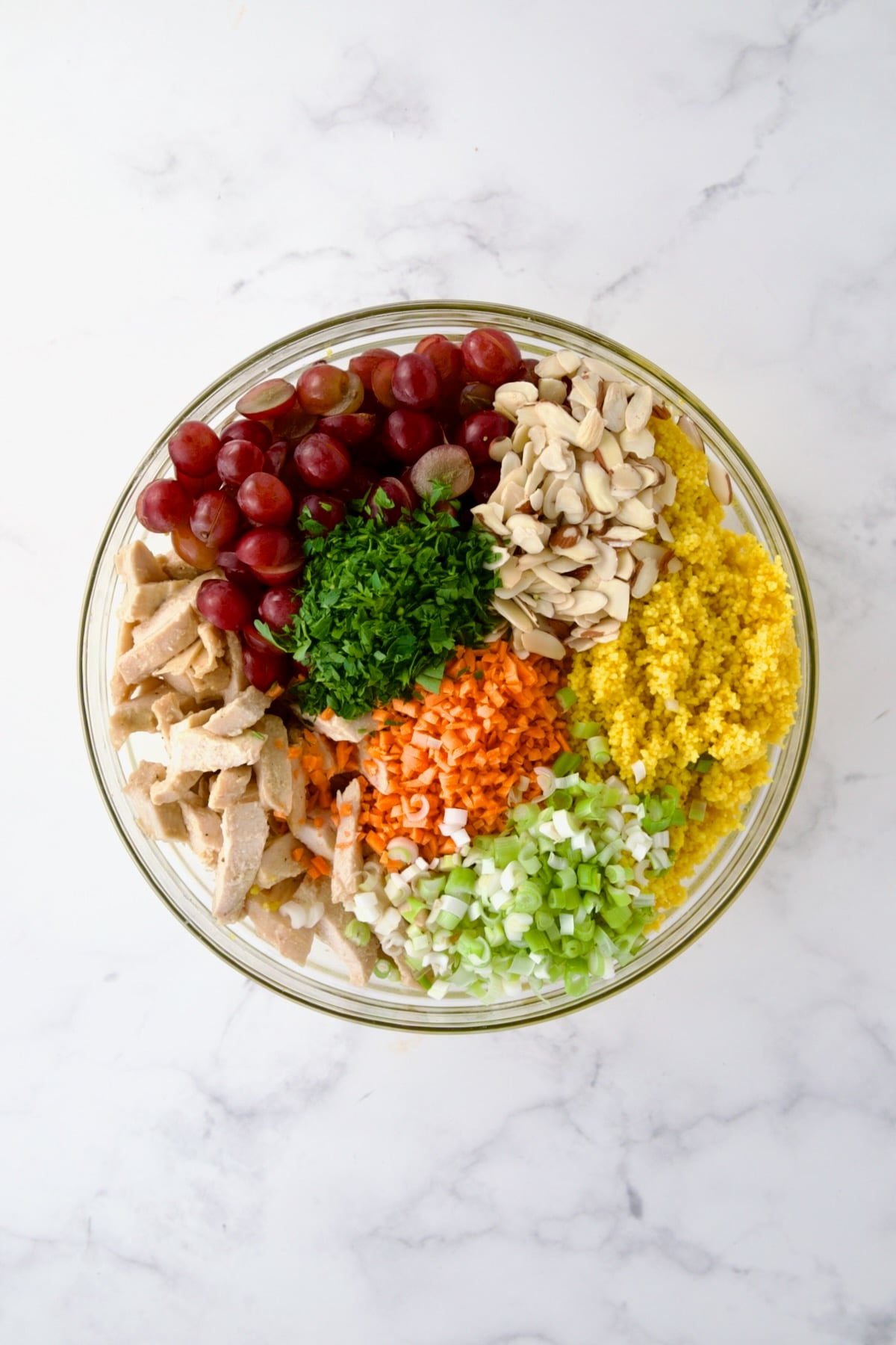 Ingredients for Chicken Couscous Salad in glass bowl before being combined.