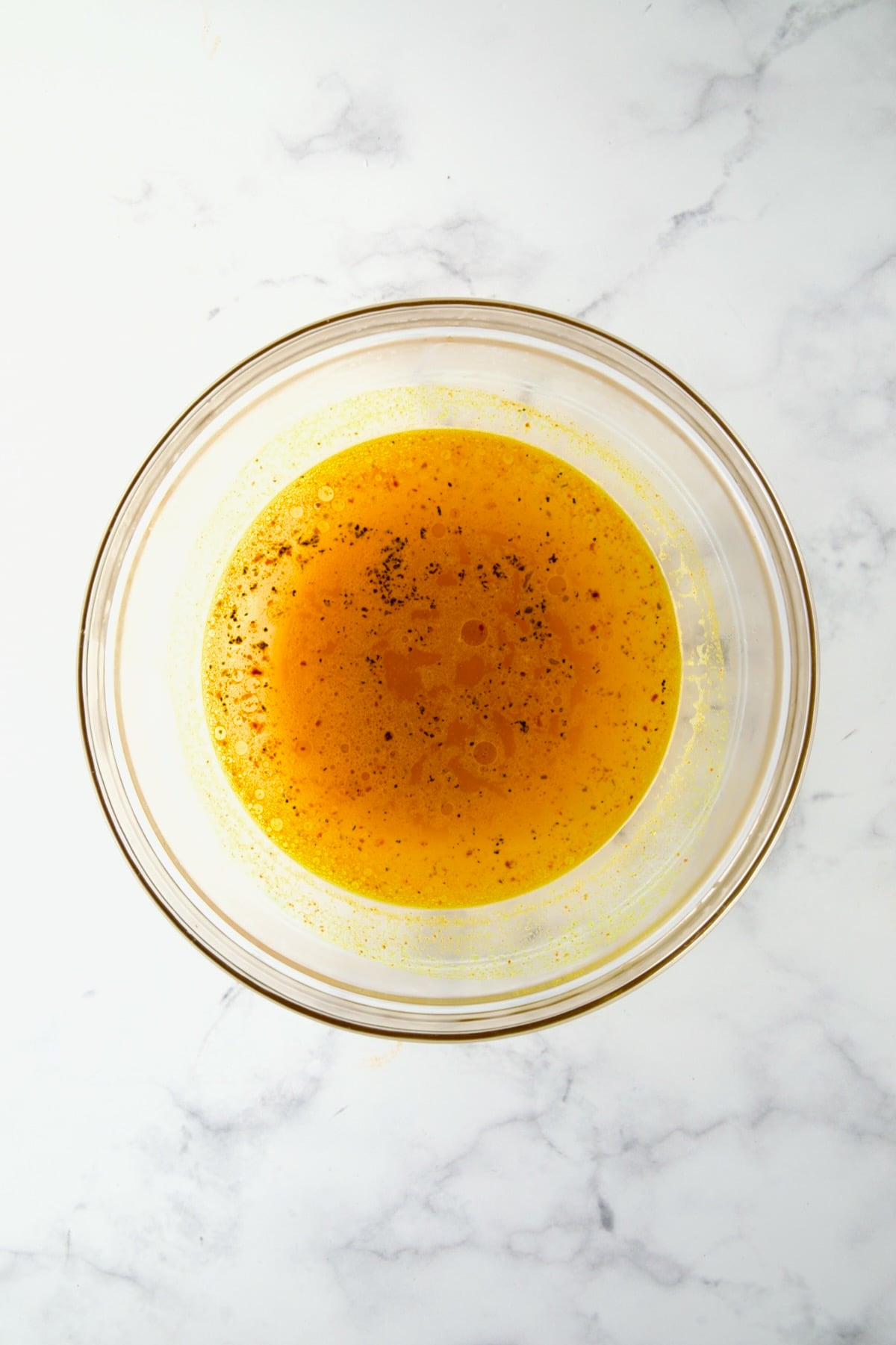 Water with seasoning in glass bowl for the couscous,