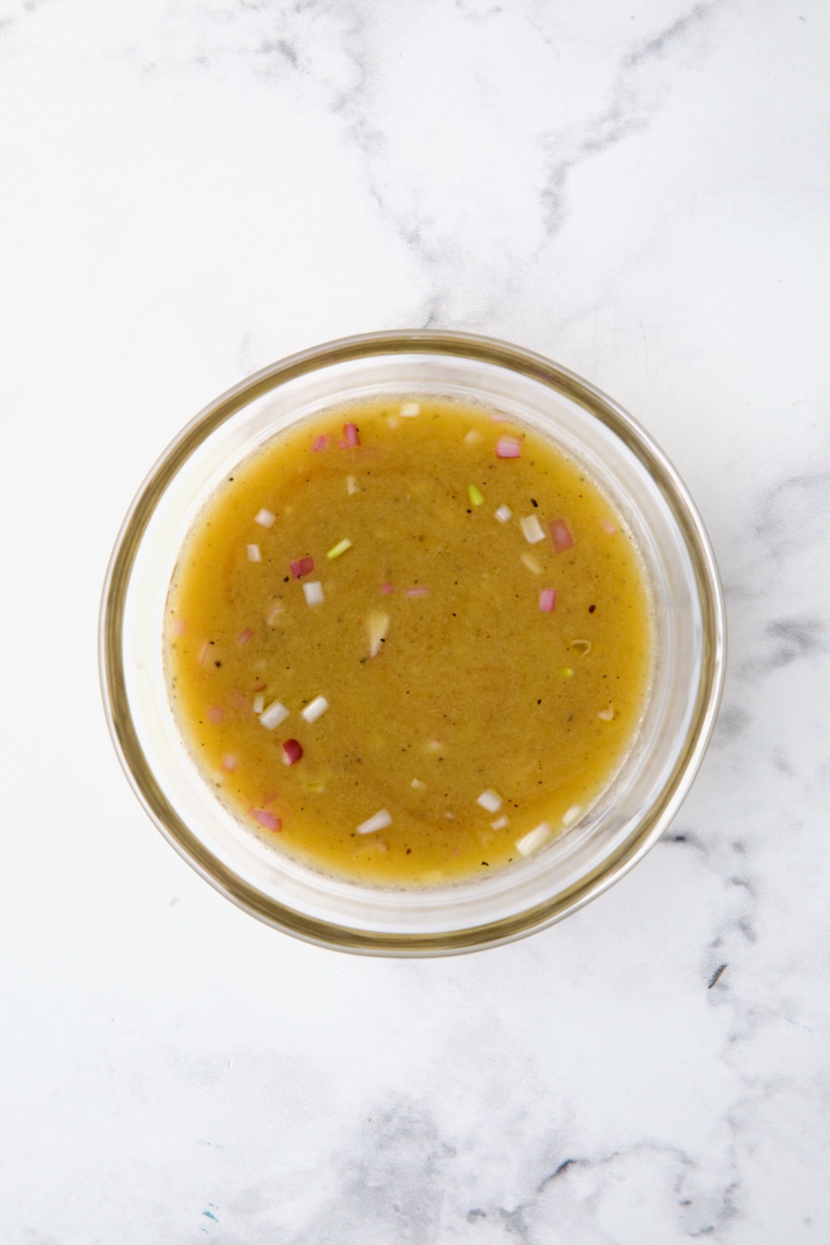 Mustard vinaigrette in glass bowl.