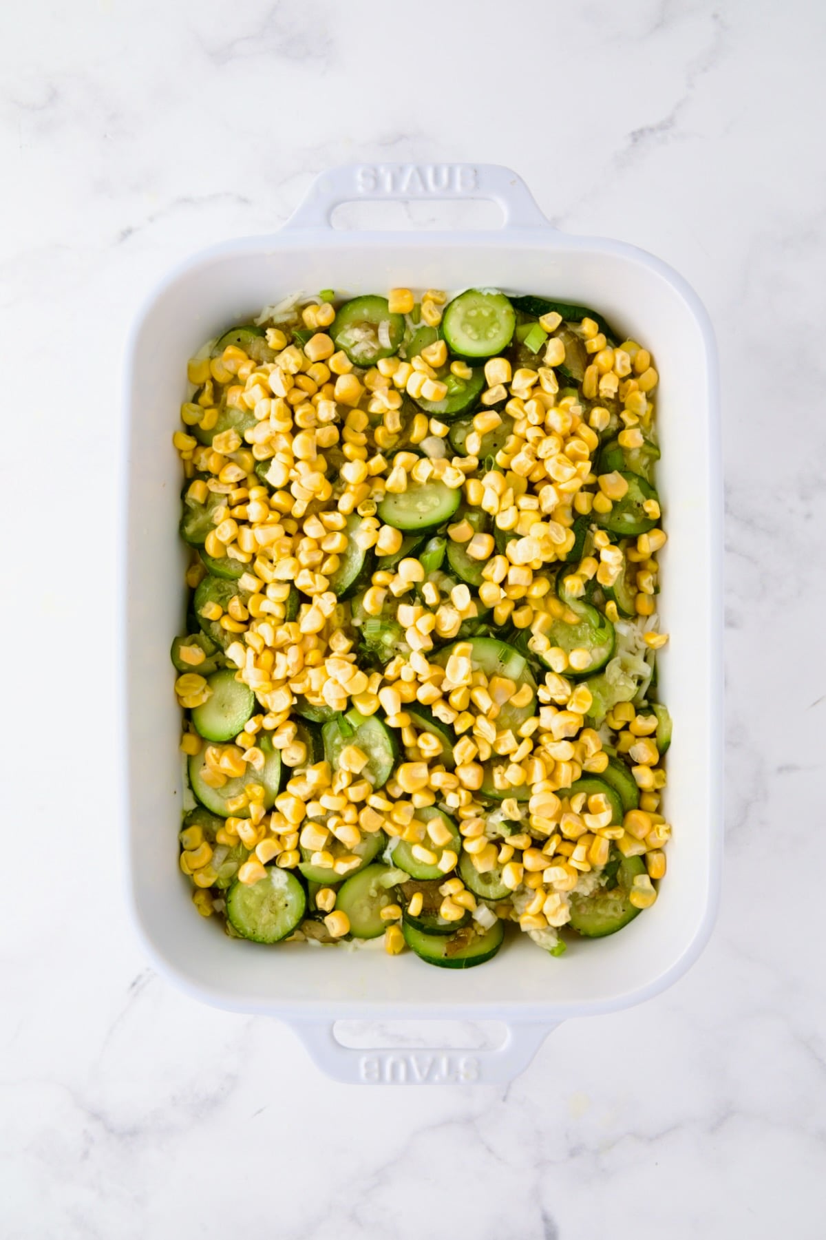 More zucchini and corn added to baking dish.