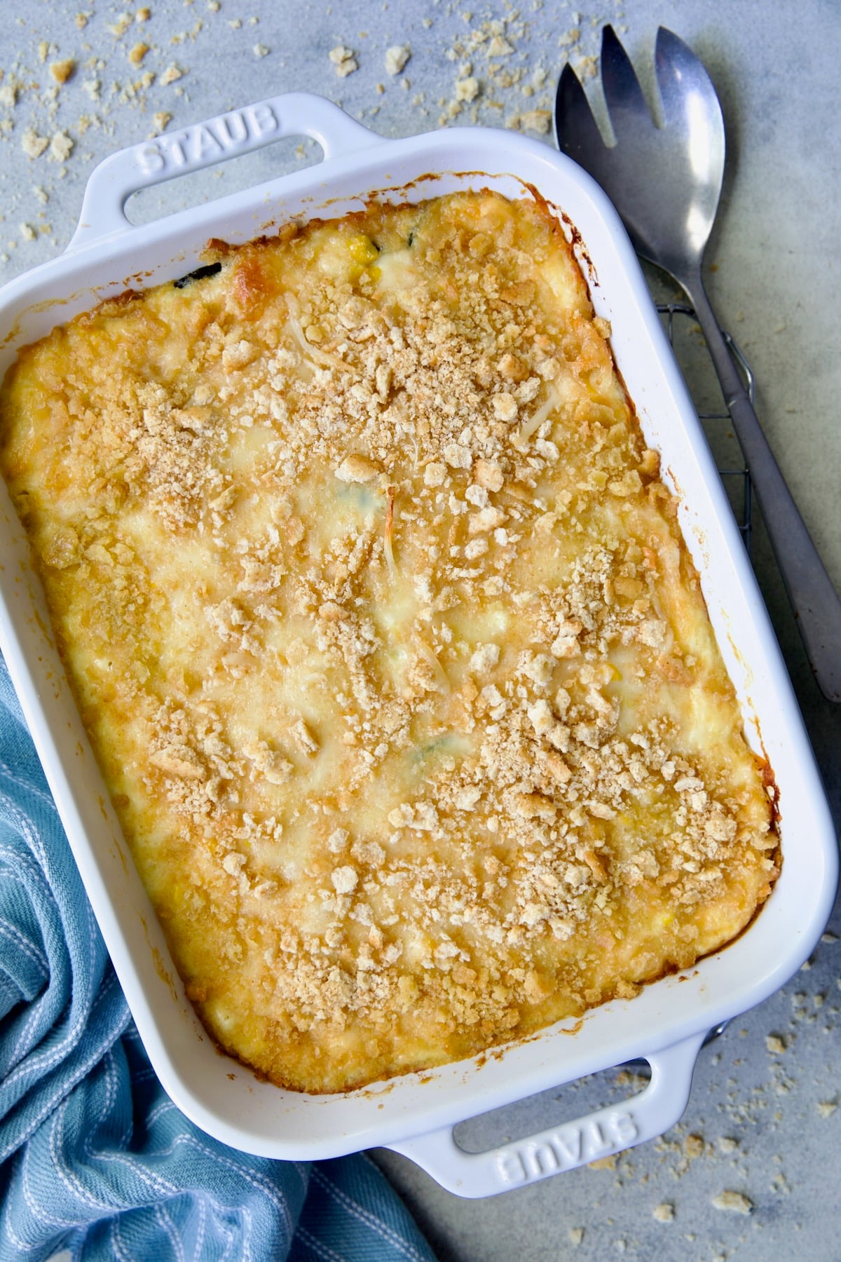 Zucchini Corn Casserole in white rectangular baking dish after being baked.