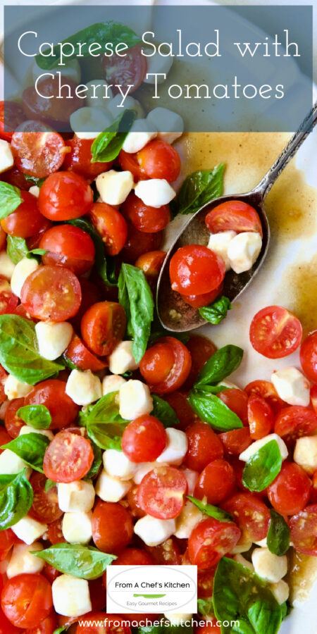 Pinterest graphic for Caprese Salad with Cherry Tomatoes showing it on a white oval platter with serving spoon scooping some up.