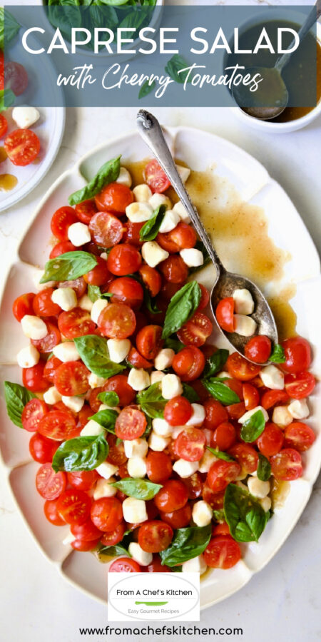 Pinterest graphic for Caprese Salad with Cherry Tomatoes showing it on a white oval platter with some served on a small plate.