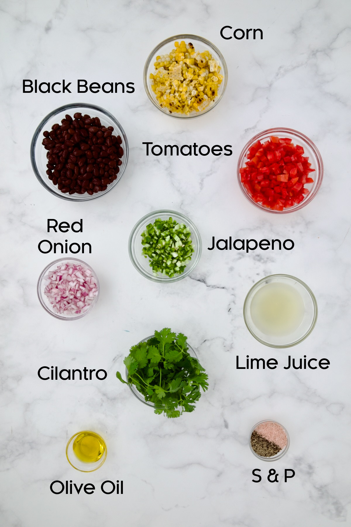 Ingredients for Black Bean Corn Tomato Salad in glass bowls.