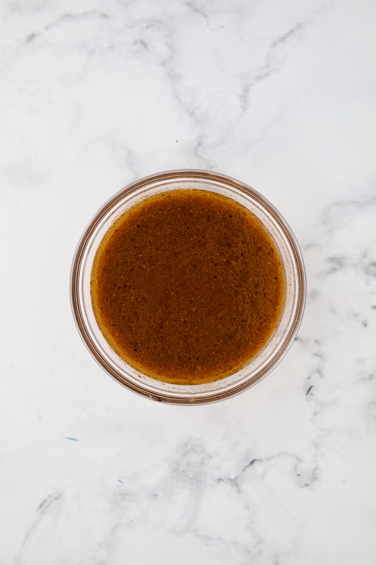 Marinade for skirt steak in glass bowl.
