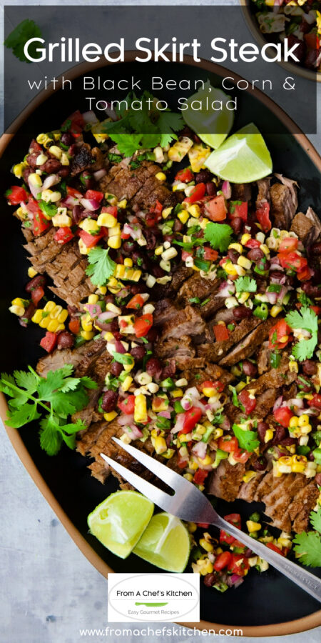 Pinterest graphic for Grilled Skirt Steak with Black Bean, Corn and Tomato Salad showing it on a black oval serving platter with serving fork.