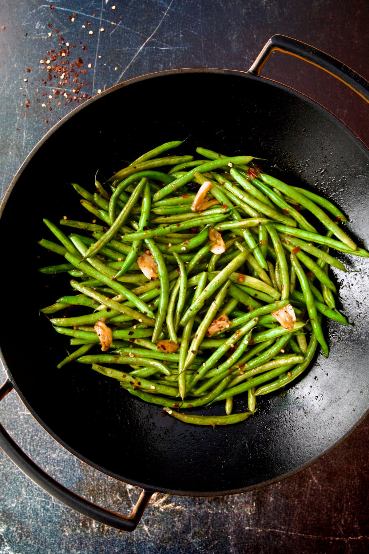 Thai Sweet Chili Green Beans in black cast iron wok.