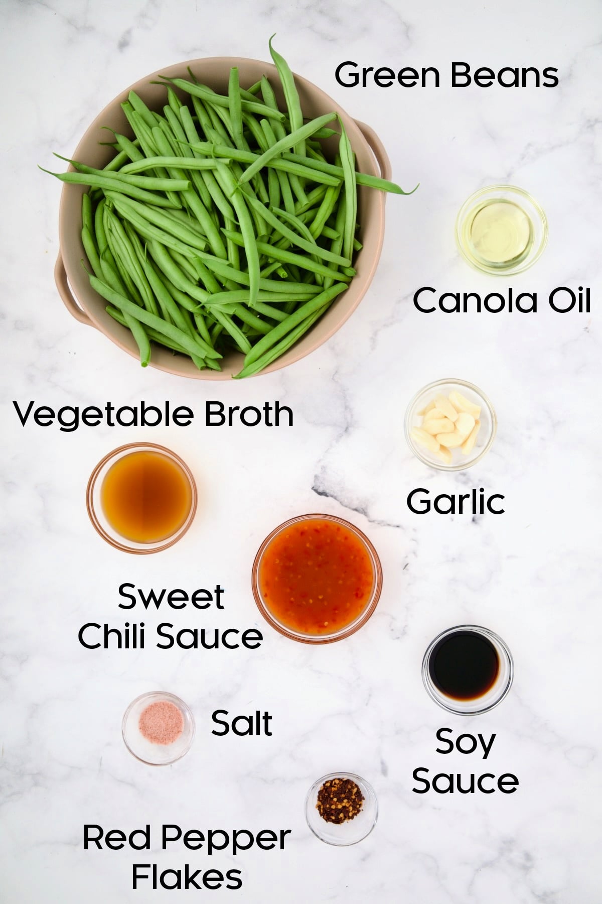 Ingredients for Thai Sweet Chili Green Beans in glass bowls.