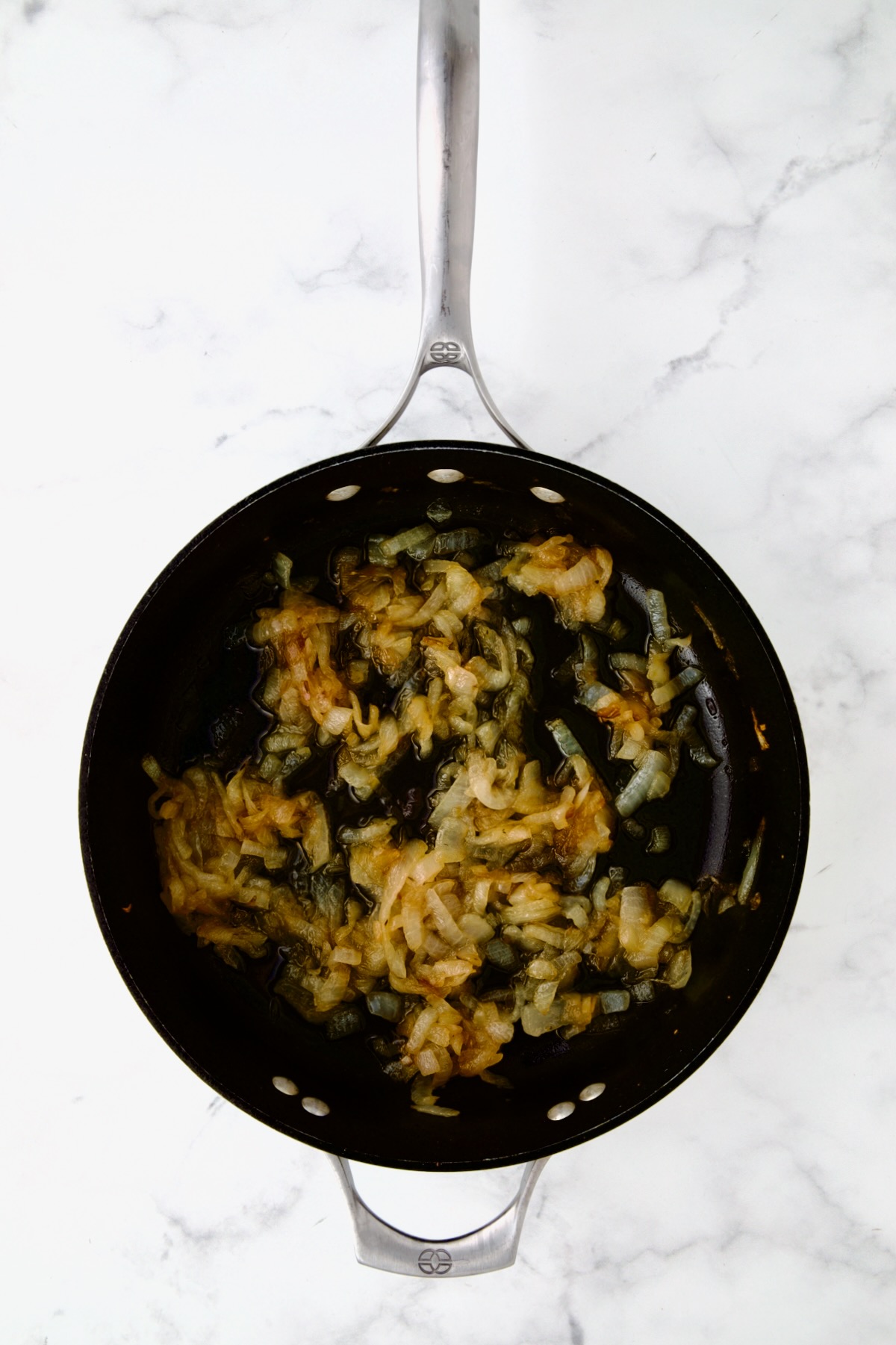 Onions cooked to golden in nonstick skillet.