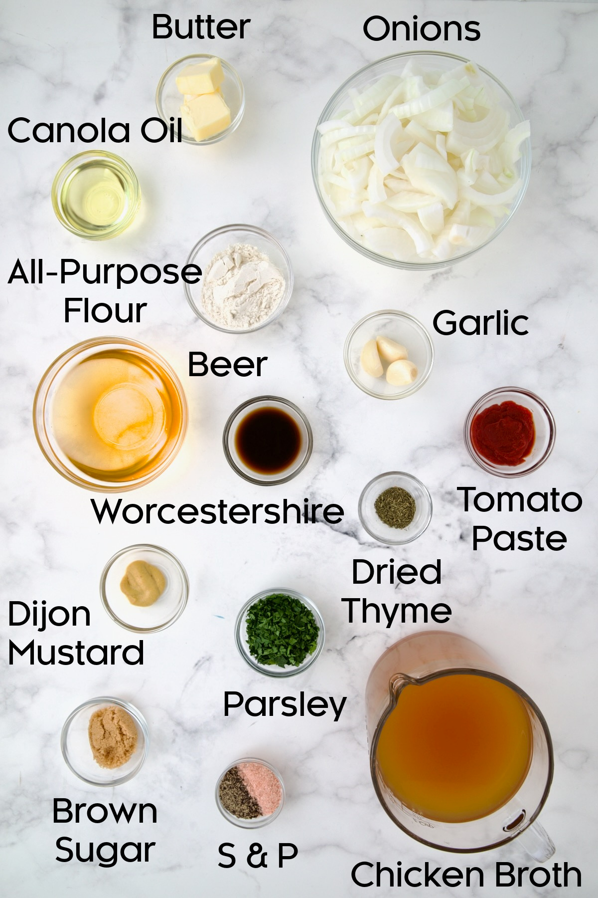 Ingredients for Beer Onion Sauce in glass bowls.