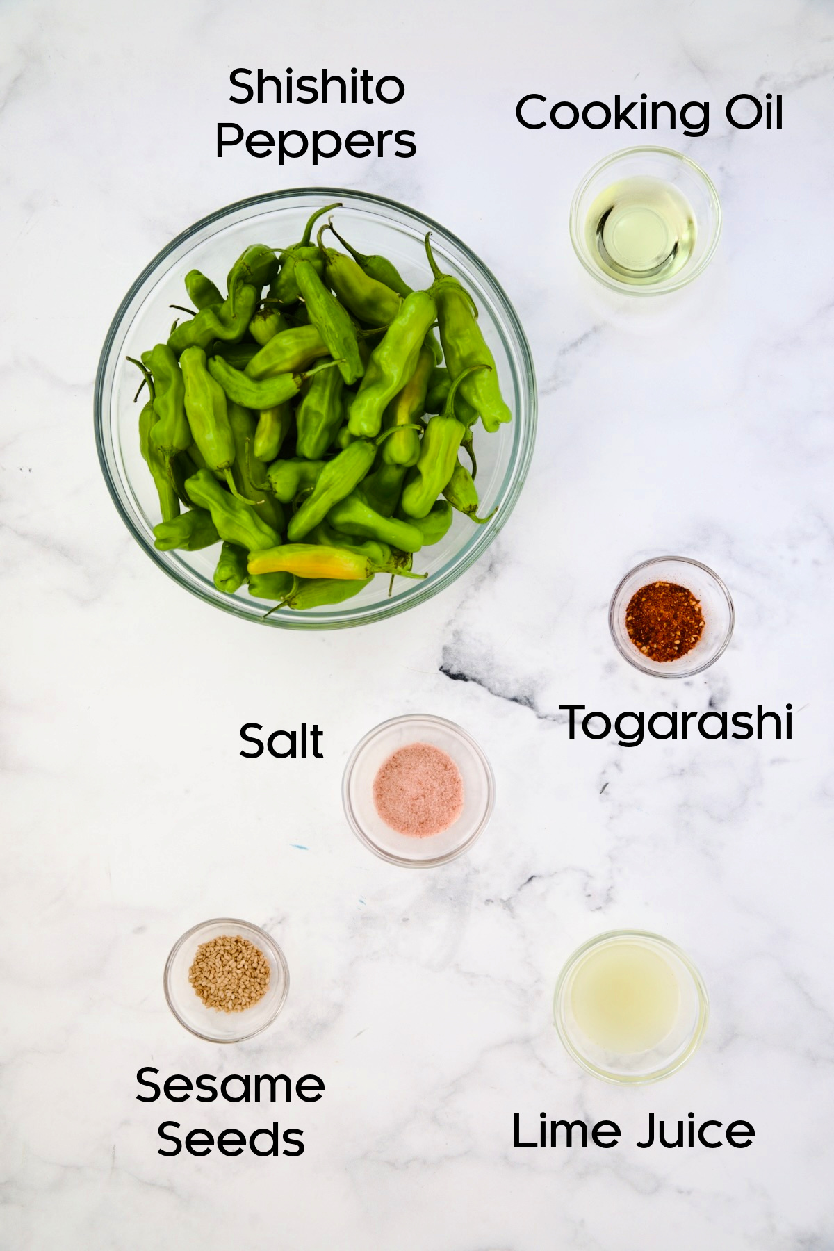 Ingredients for Blistered Shishito Peppers in glass bowls.
