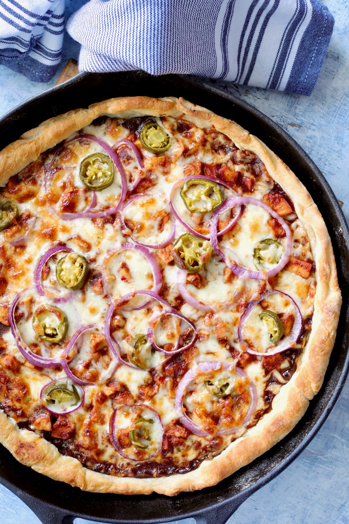 Whole Cast Iron Skillet Pizza in black cast iron skillet.