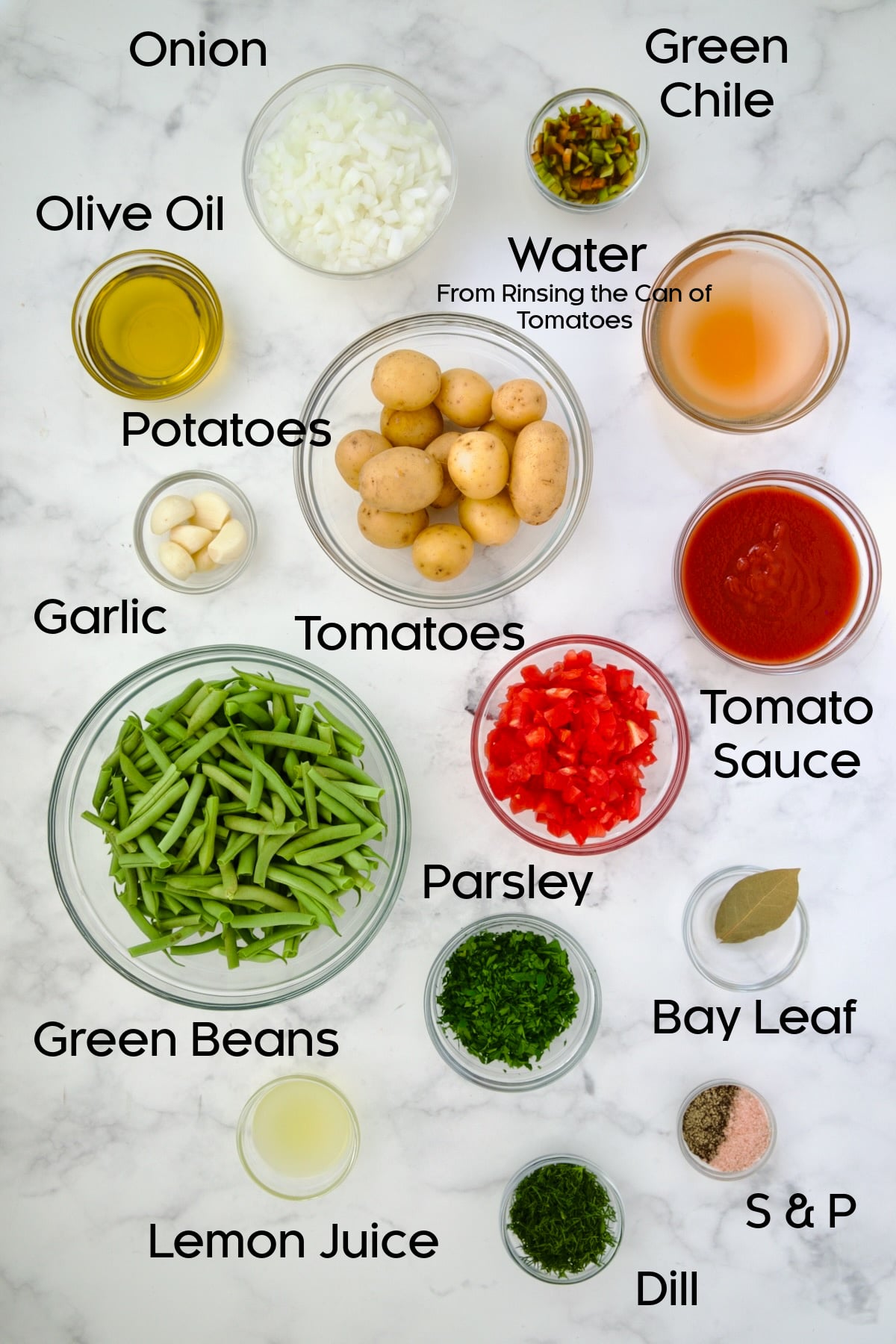 Ingredients for Fasolakia in glass bowls.
