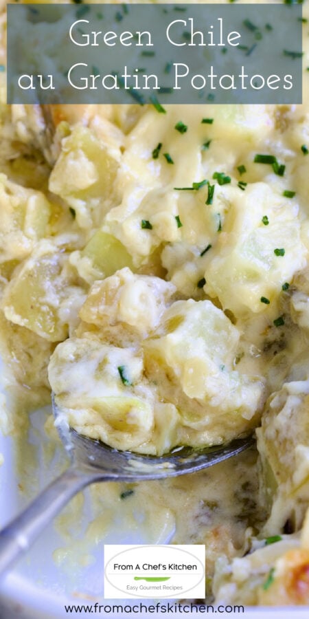 Pinterest graphic for Green Chile au Gratin Potatoes showing it in a white rectangular baking dish with serving spoon scooping some up.