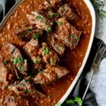 Italian Pot Roast (Stracotto) on gray-rimmed platter.