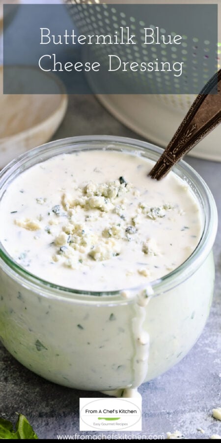 Pinterest graphic for Best Blue Cheese Dressing Recipe showing it in a glass jar with spoon.