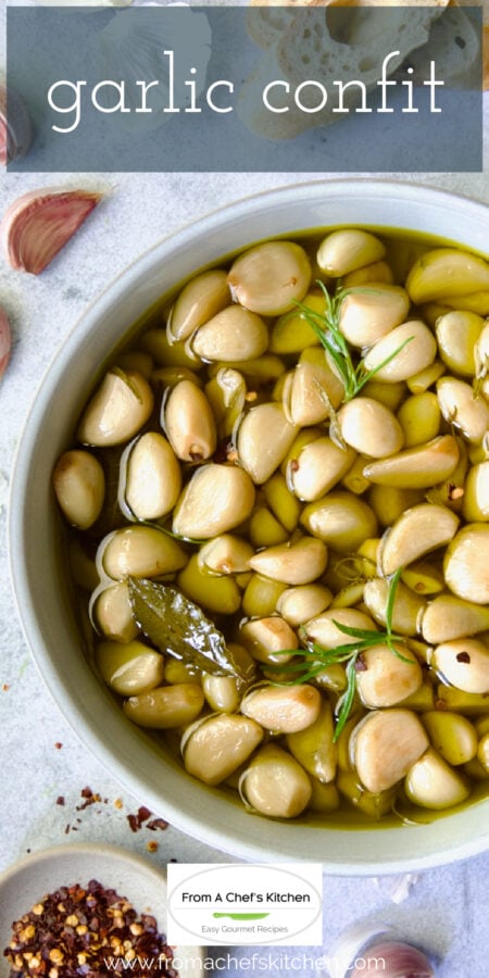 Pinterest graphic for Garlic Confit showing it in round earthenware bowl.