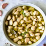 Garlic Confit in round earthenware bowl.