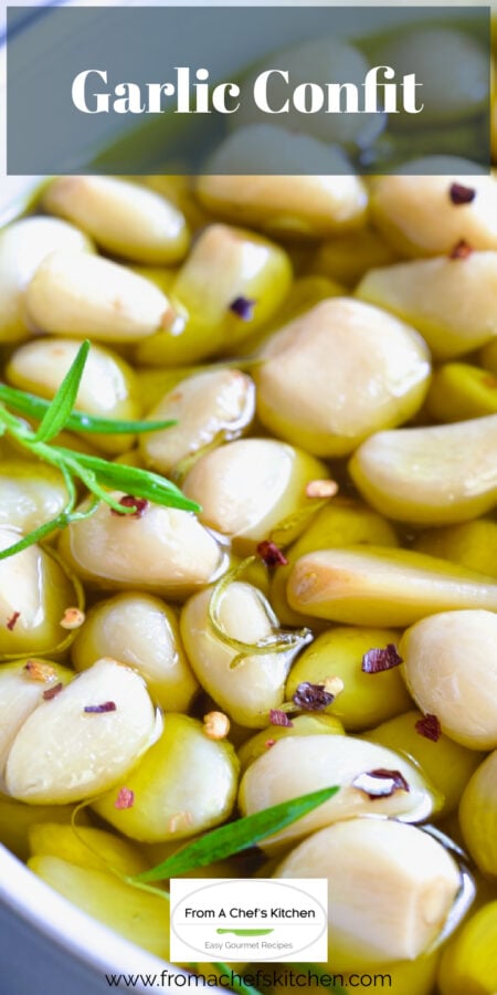 Pinterest graphic for Garlic Confit showing it garnished with fresh rosemary leaves.
