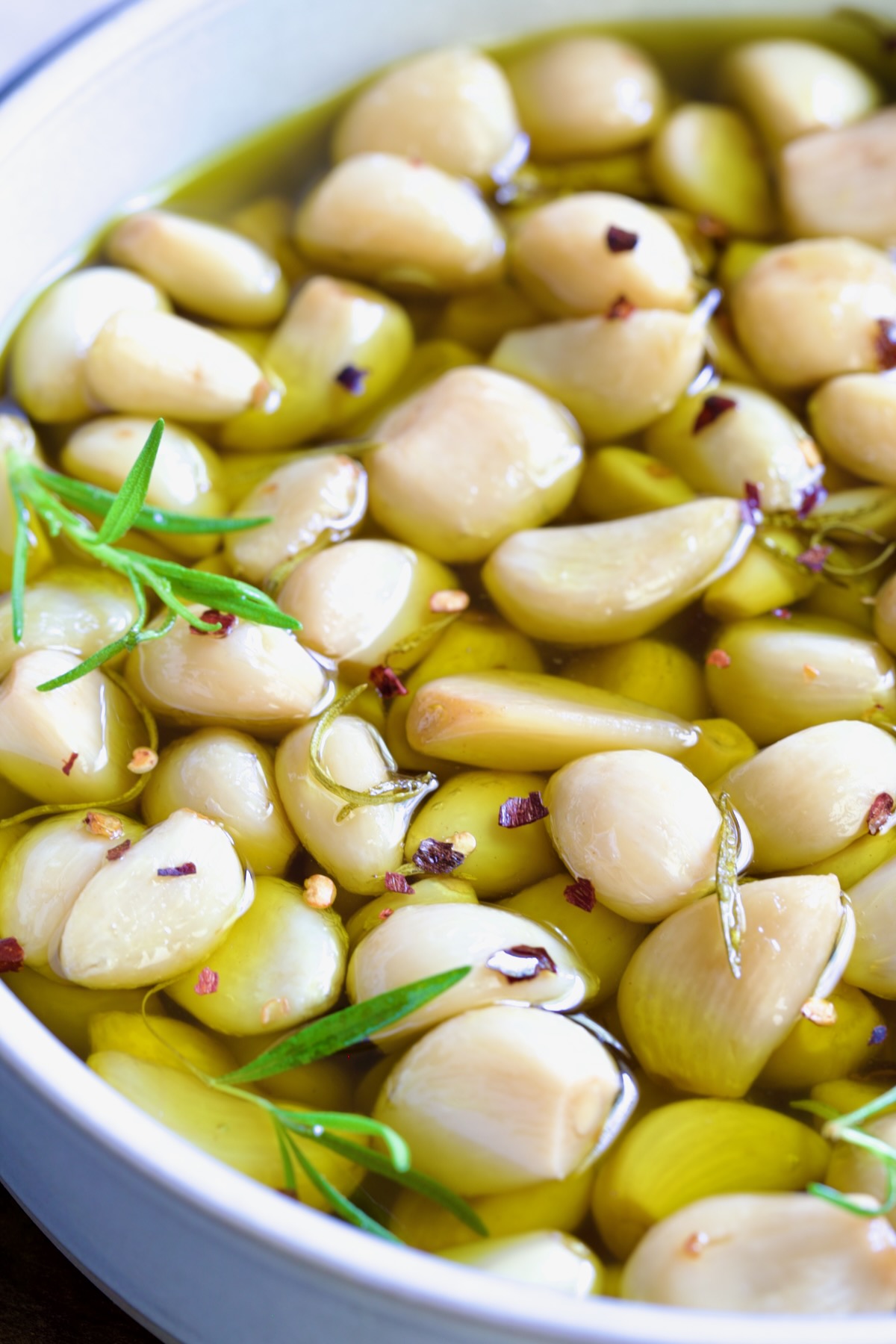 Garlic Confit in round earthenware bowl.
