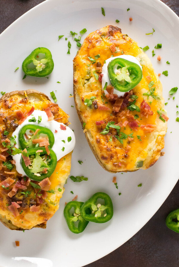 Jalapeno Popper Twice-Baked Potatoes on white plate.