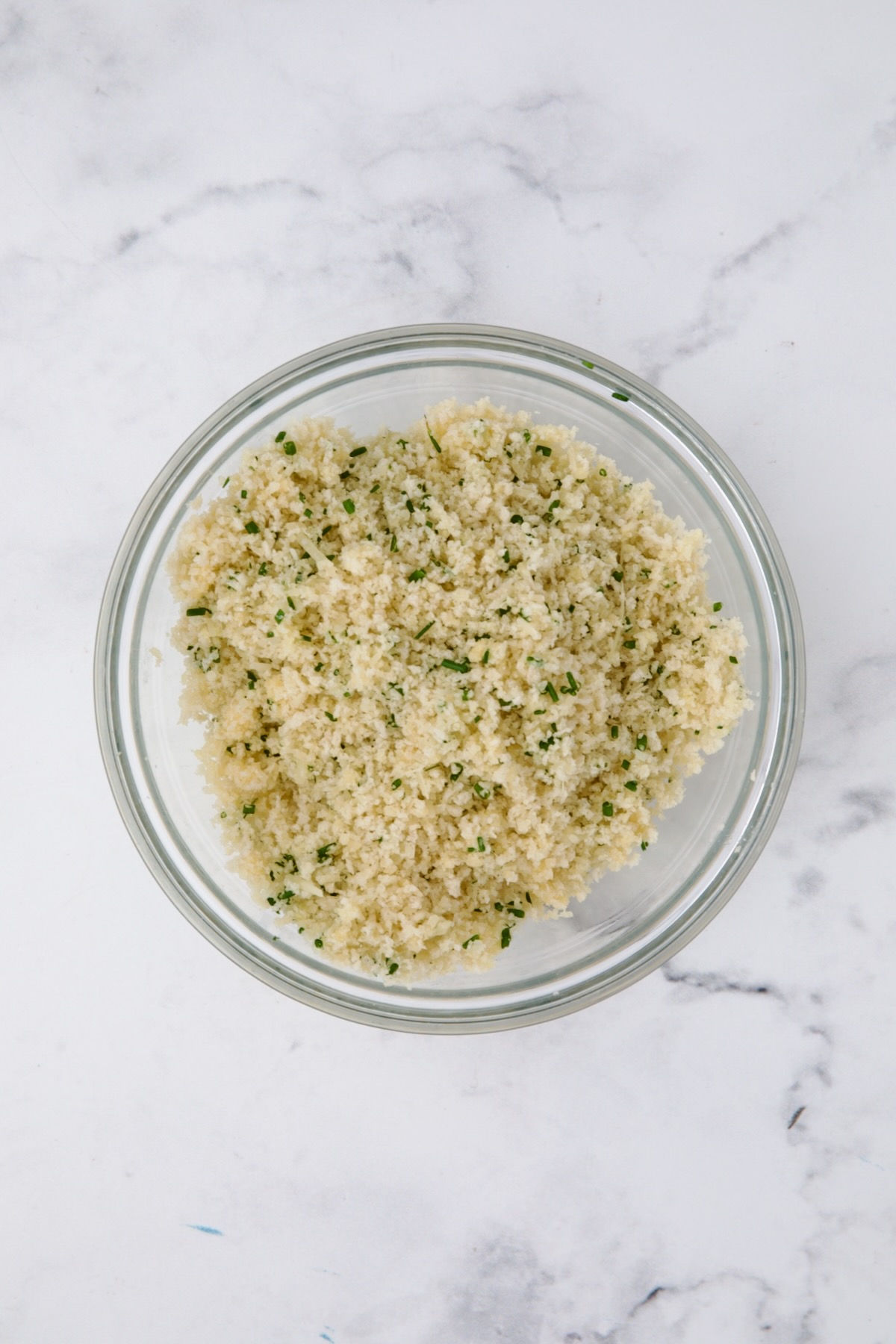 Parmesan and panko topping in glass bowl.