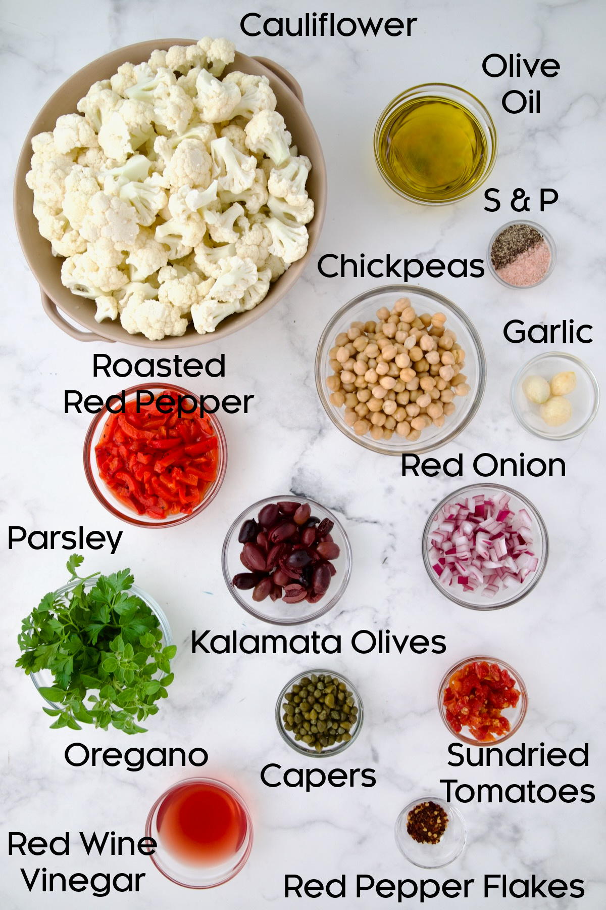Ingredients for Roasted Cauliflower Salad in glass bowls.