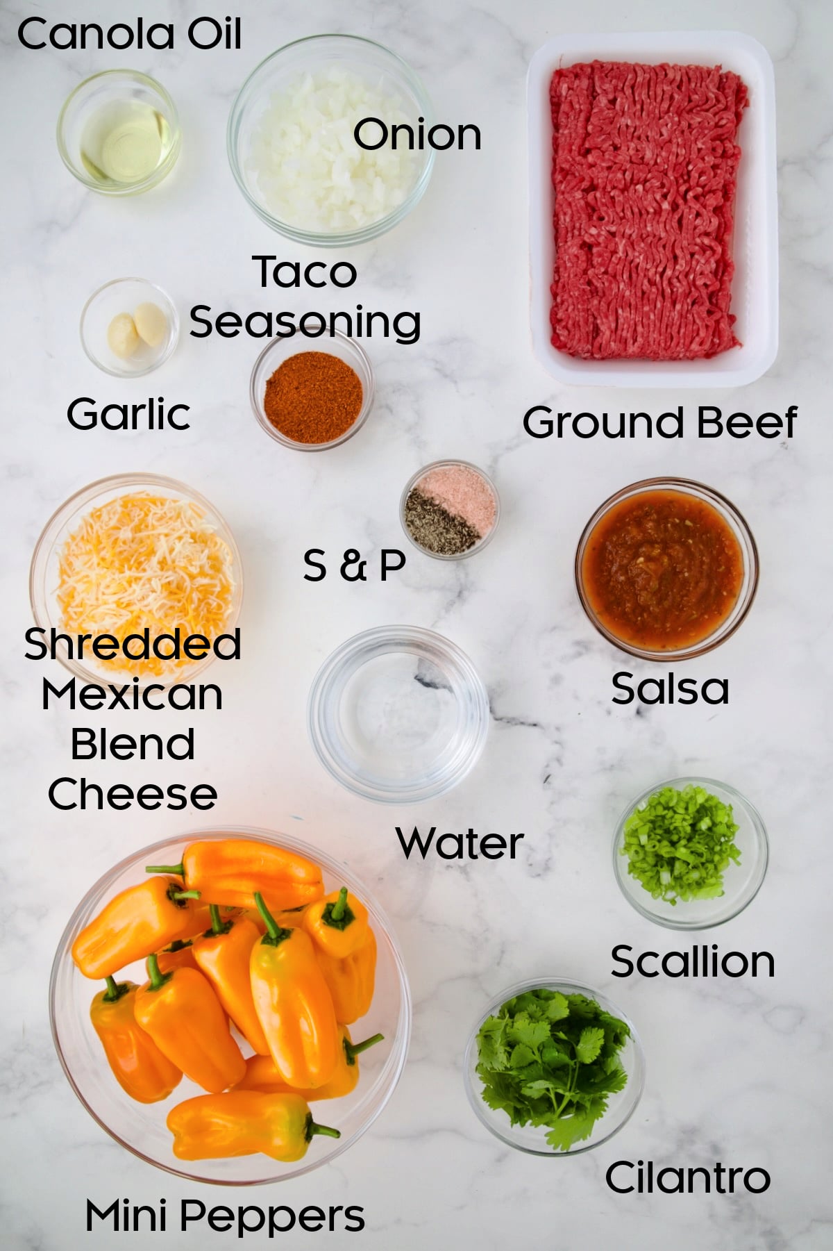 Ingredients for Taco-Stuffed Mini Peppers in glass bowls.