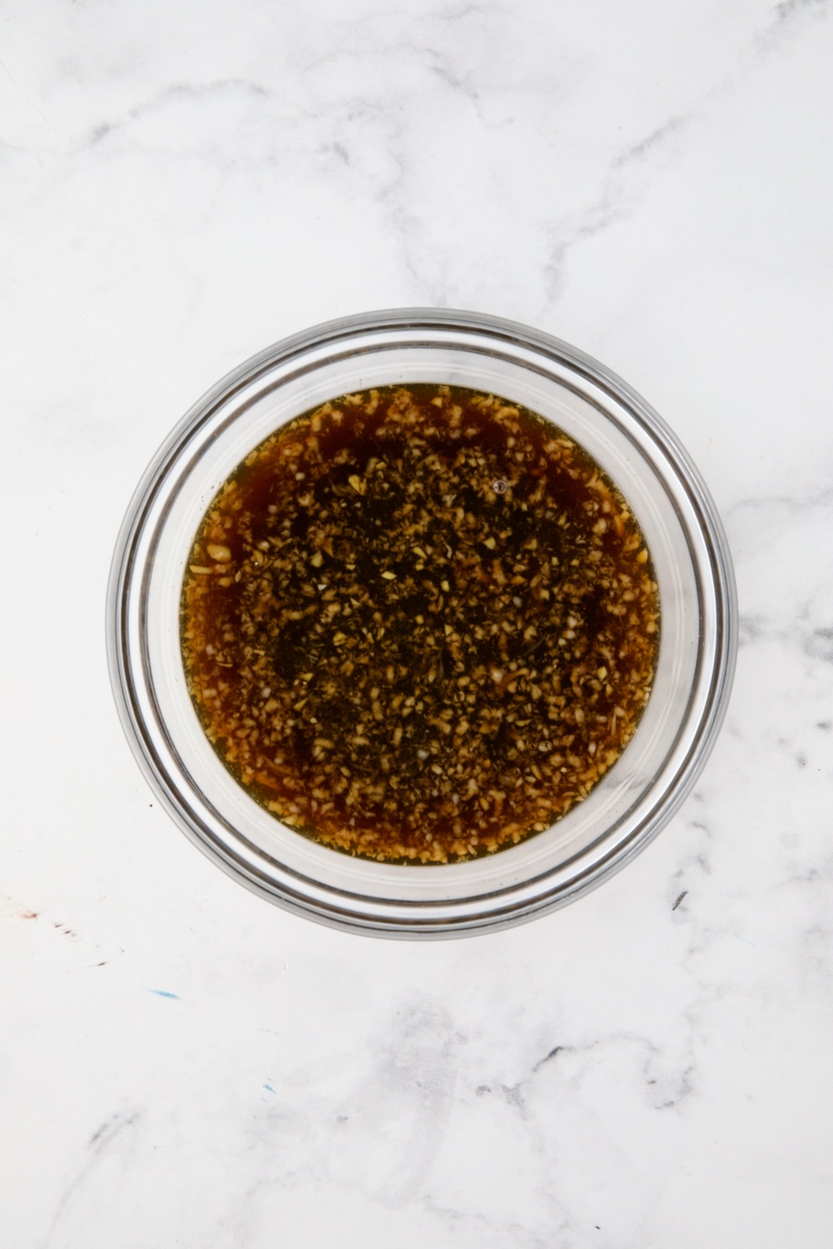 Dipping sauce in glass bowl.