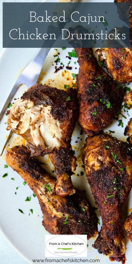 Pinterest graphic for Baked Cajun Chicken Drumsticks showing them on a white platter.