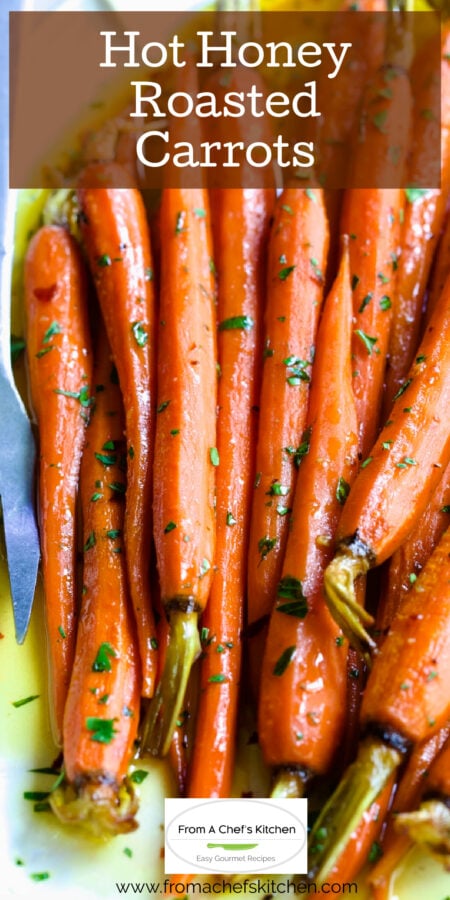 Pinterest graphic for Hot Honey Roasted Carrots on white platter with serving fork.