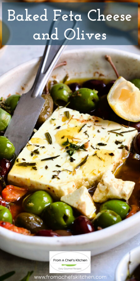 Pinterest graphic for Baked Feta Cheese and Olives showing it in a white oval baking dish.