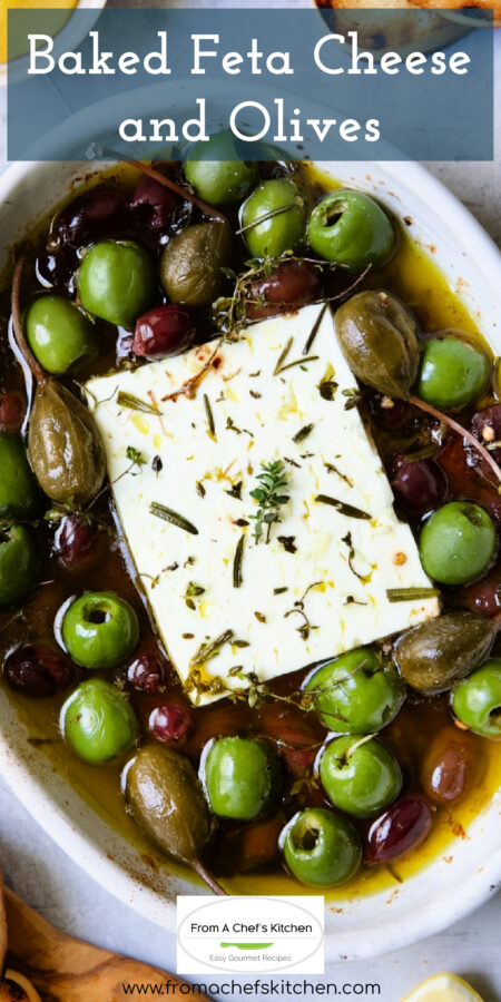 Pinterest graphic for Baked Feta Cheese and Olives showing it in a white oval baking dish.