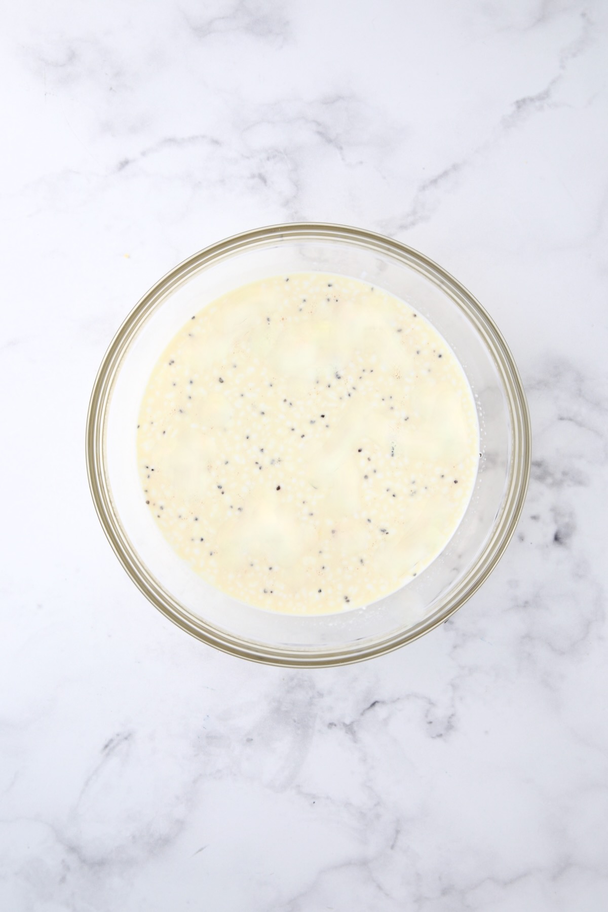 Custard for quiche in glass bowl.