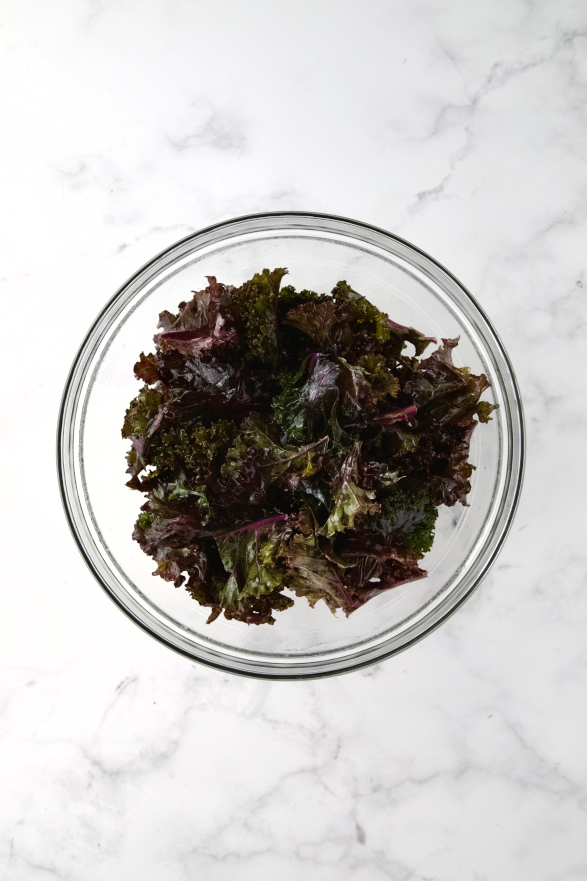 Wilted kale in glass bowl.