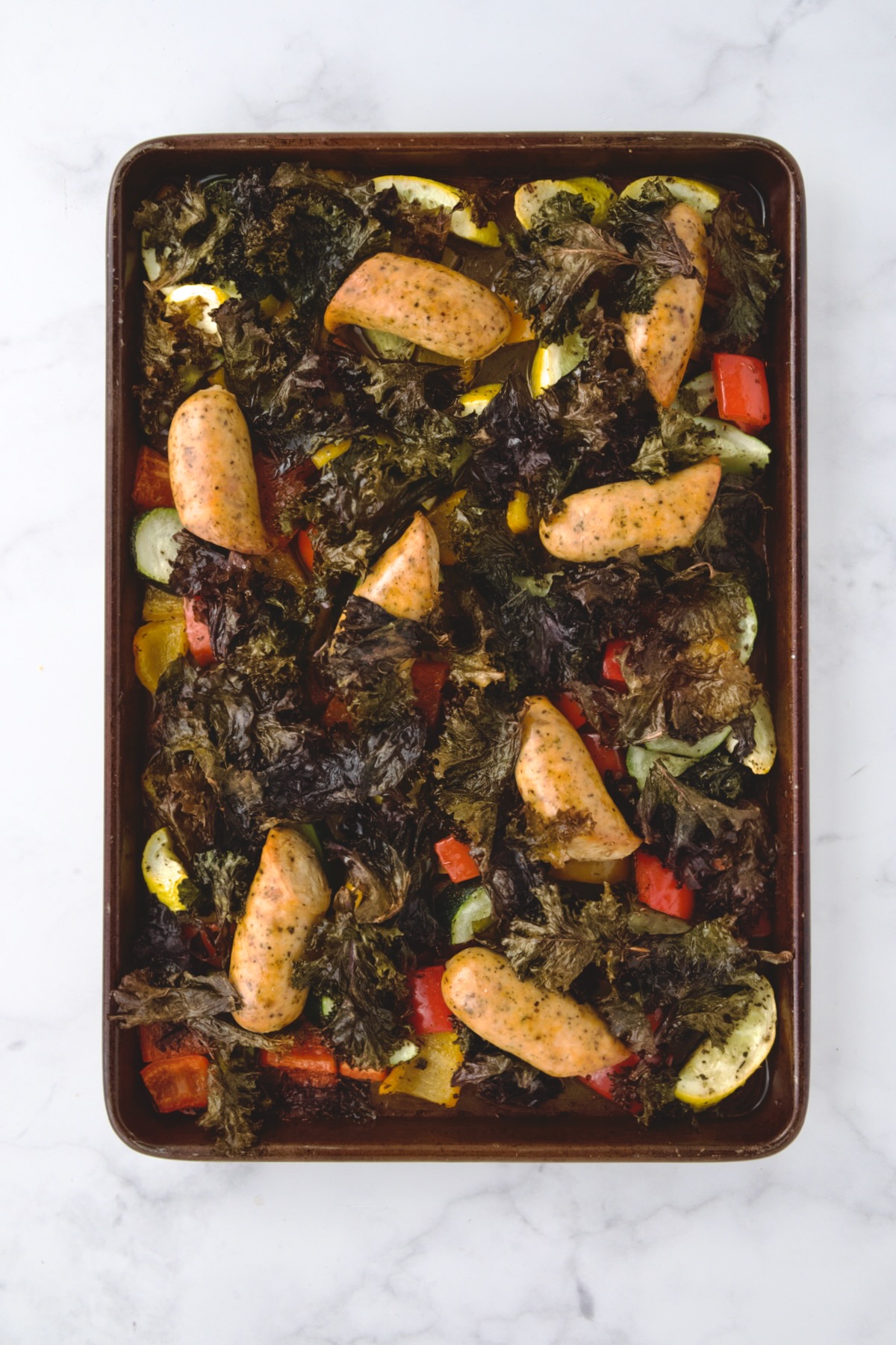 Finished Chicken Sausage Sheet Pan on rimmed sheet pan.