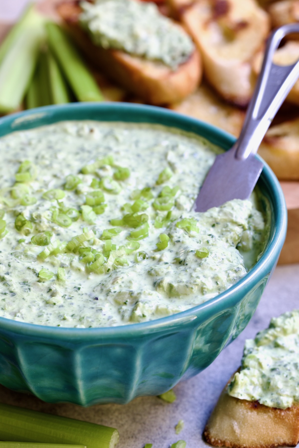 Spinach Artichoke Dip in Blue Bowl.