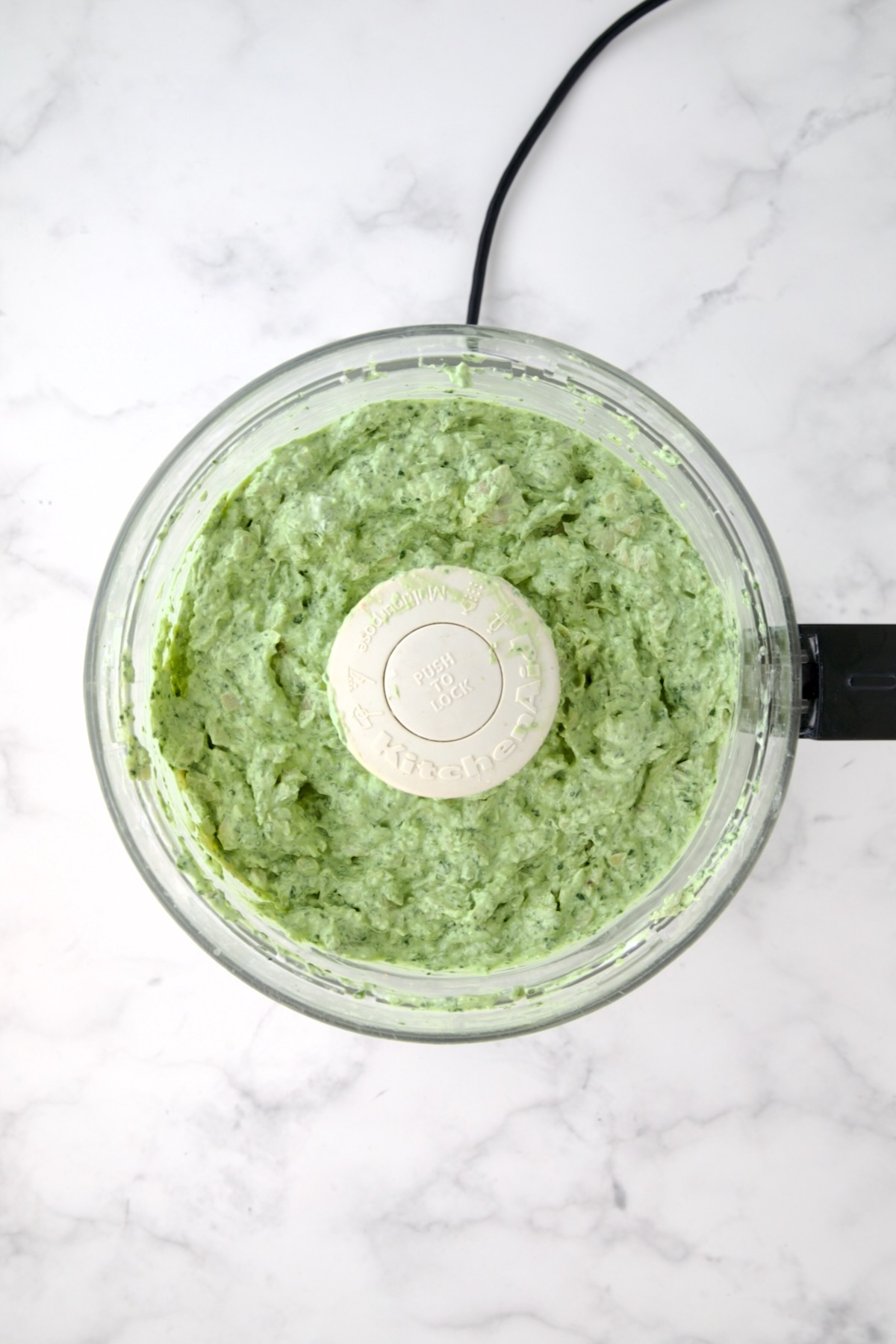 Finished dip in food processor with all ingredients combined.