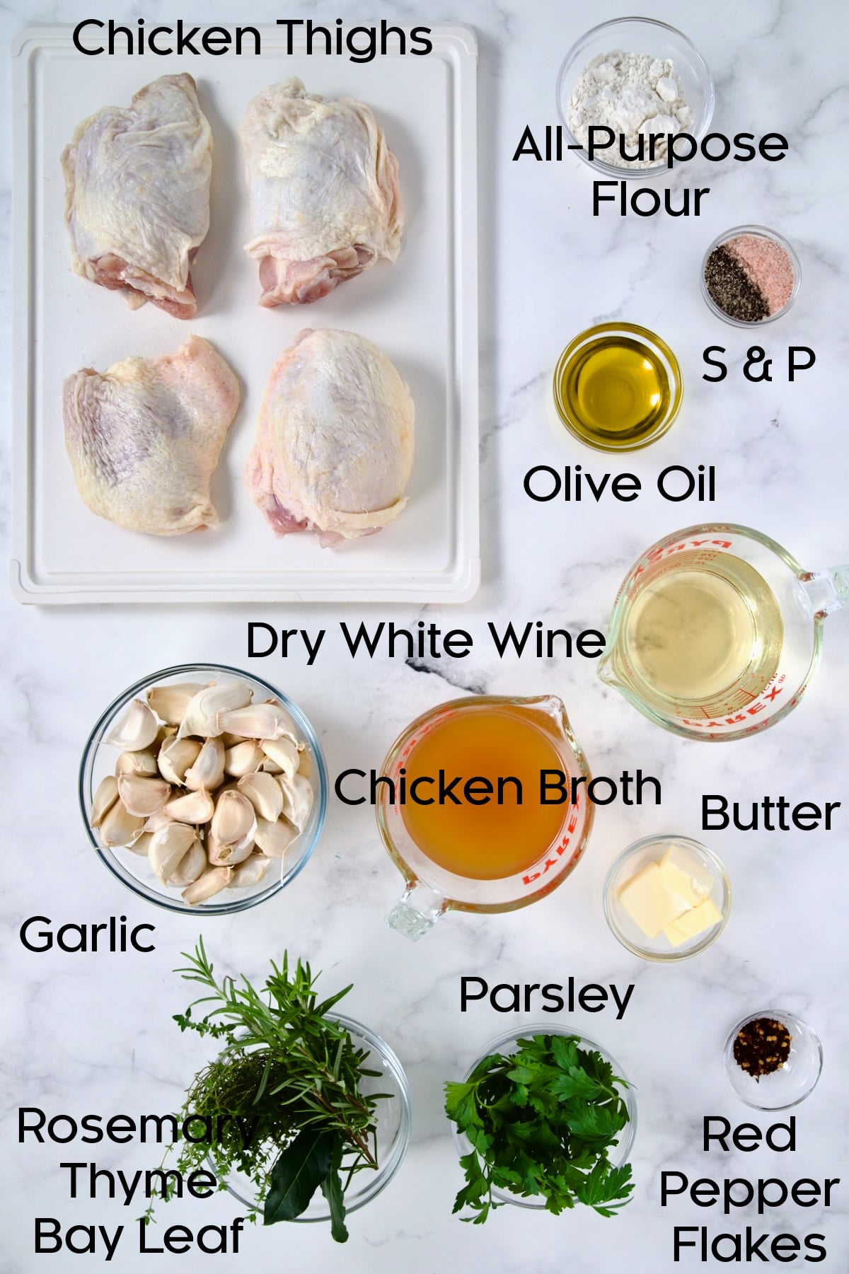 Ingredients for 40 Clove Garlic Chicken in glass bowls.