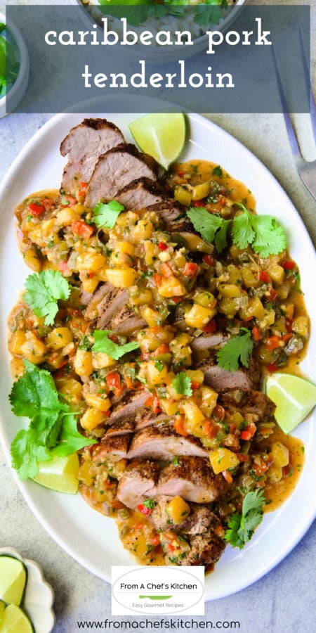 Pinterest graphic for Caribbean Pork Tenderloin showing it on an oval white platter garnished with cilantro sprigs and lime wedges.
