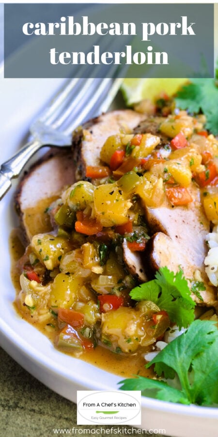 Pinterest graphic for Caribbean Pork Tenderloin showing one serving on a white plate garnished with cilantro sprigs and lime wedges.