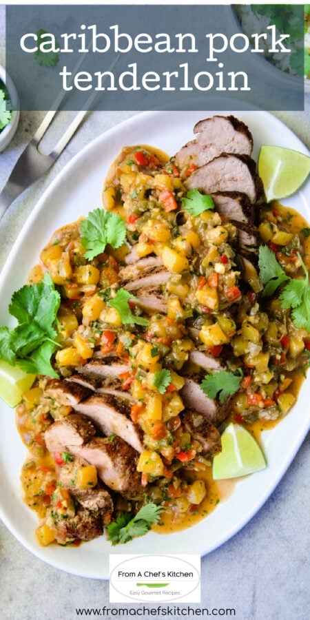 Pinterest graphic for Caribbean Pork Tenderloin showing it on an oval white platter garnished with cilantro sprigs and lime wedges.