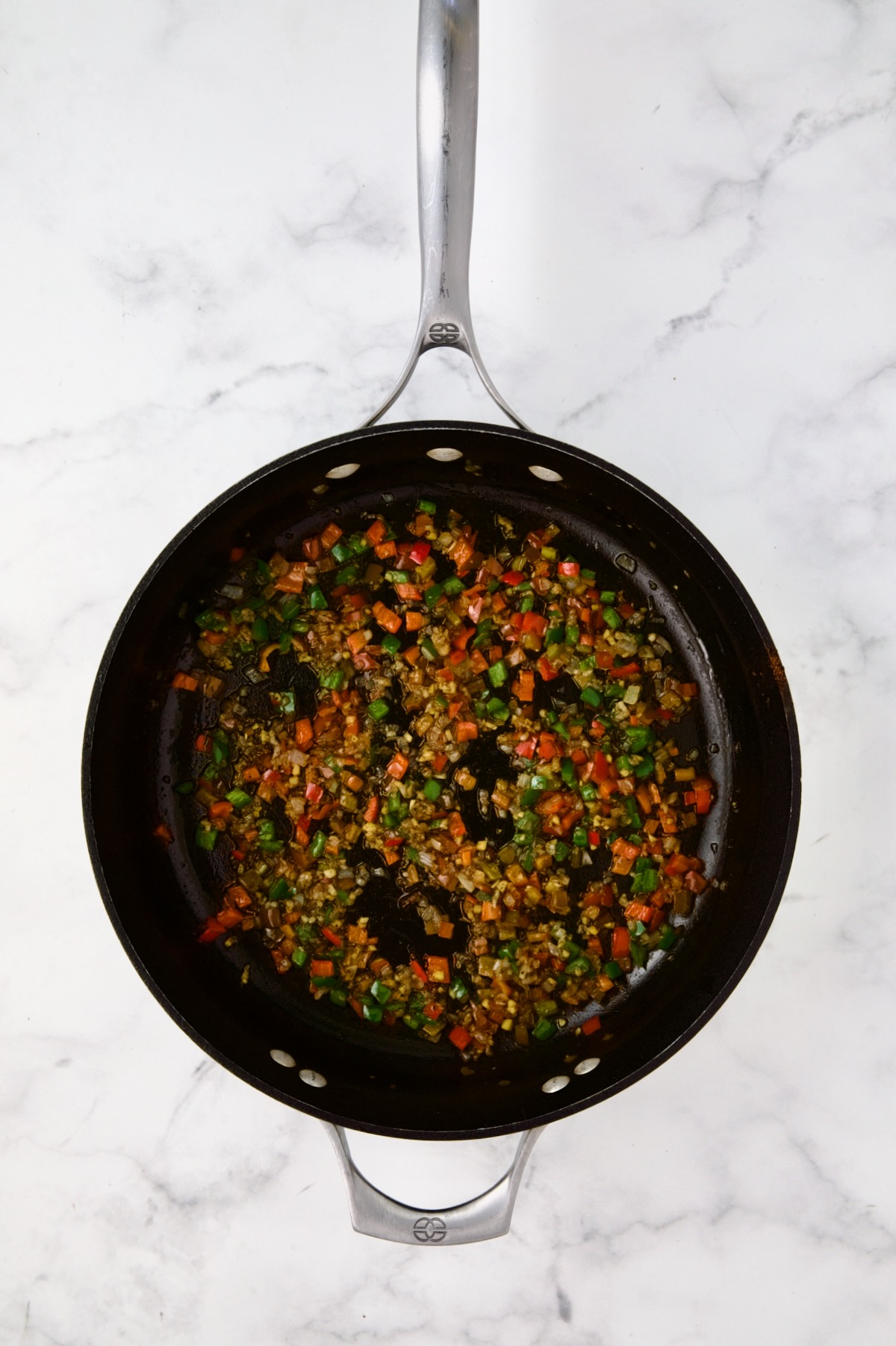 Cooked shallots, red bell pepper and jalapeno in nonstick skillet.