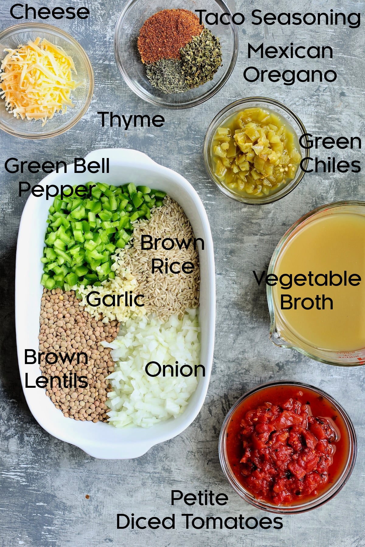 Ingredients for Southwestern Lentil and Brown Rice Bake in glass bowls.
