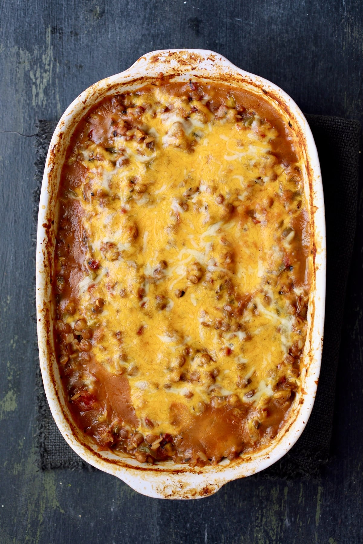 Southwestern Lentil and Brown Rice Bake in oval white baking dish after being baked.