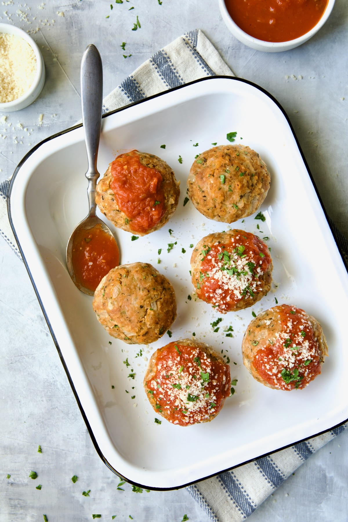 Six Turkey Meatloaf Muffins in white enamel pan.
