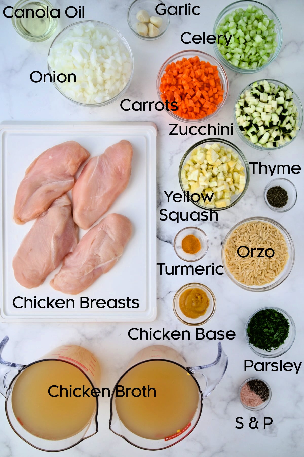 Ingredients for Chicken Vegetable Soup with Orzo in glass bowls.