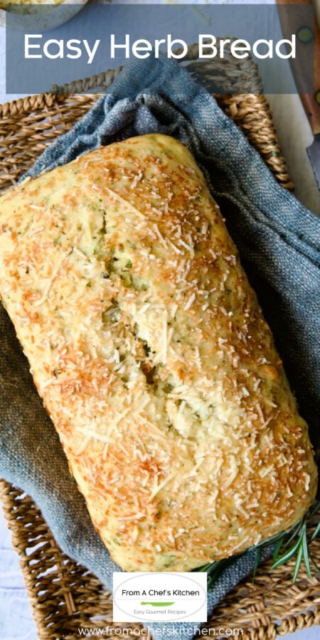 Pinterest graphic for Easy Herb Bread showing it whole on a blue napkin in wicker basket.