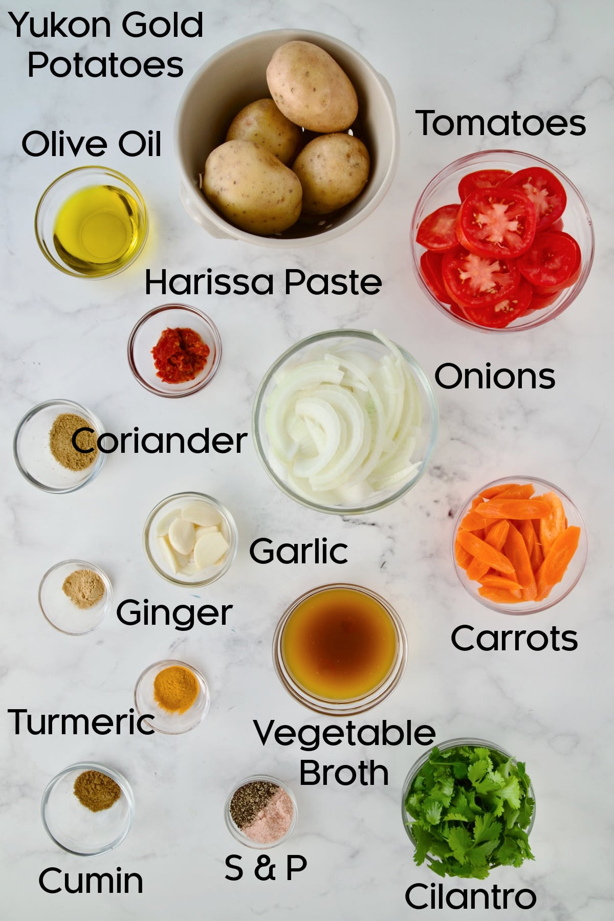 Ingredients for Moroccan Potato Tagine in glass bowls.
